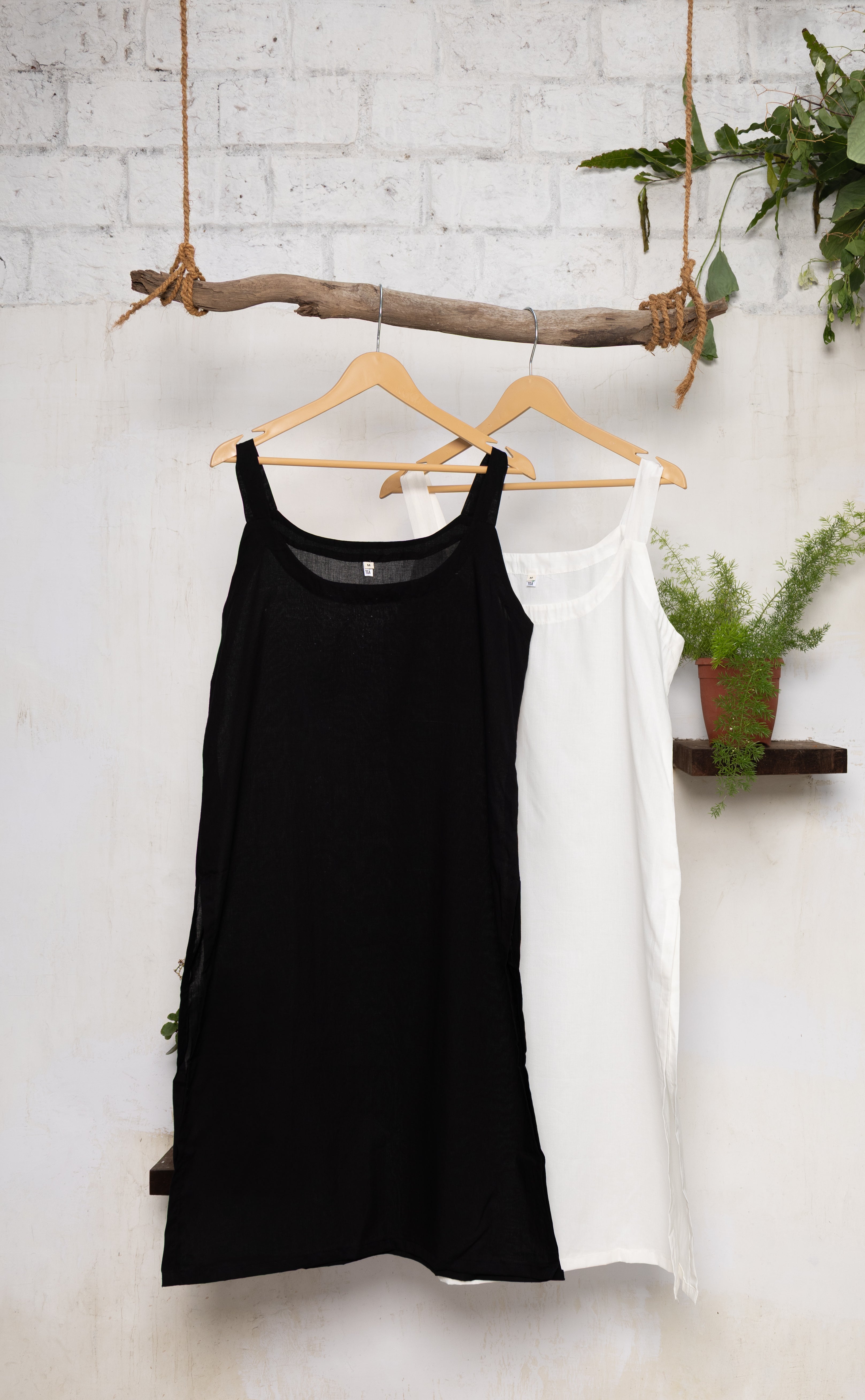 Cotton underslips in black and white, perfect for layering under sheer kurtas, tops, or dresses.