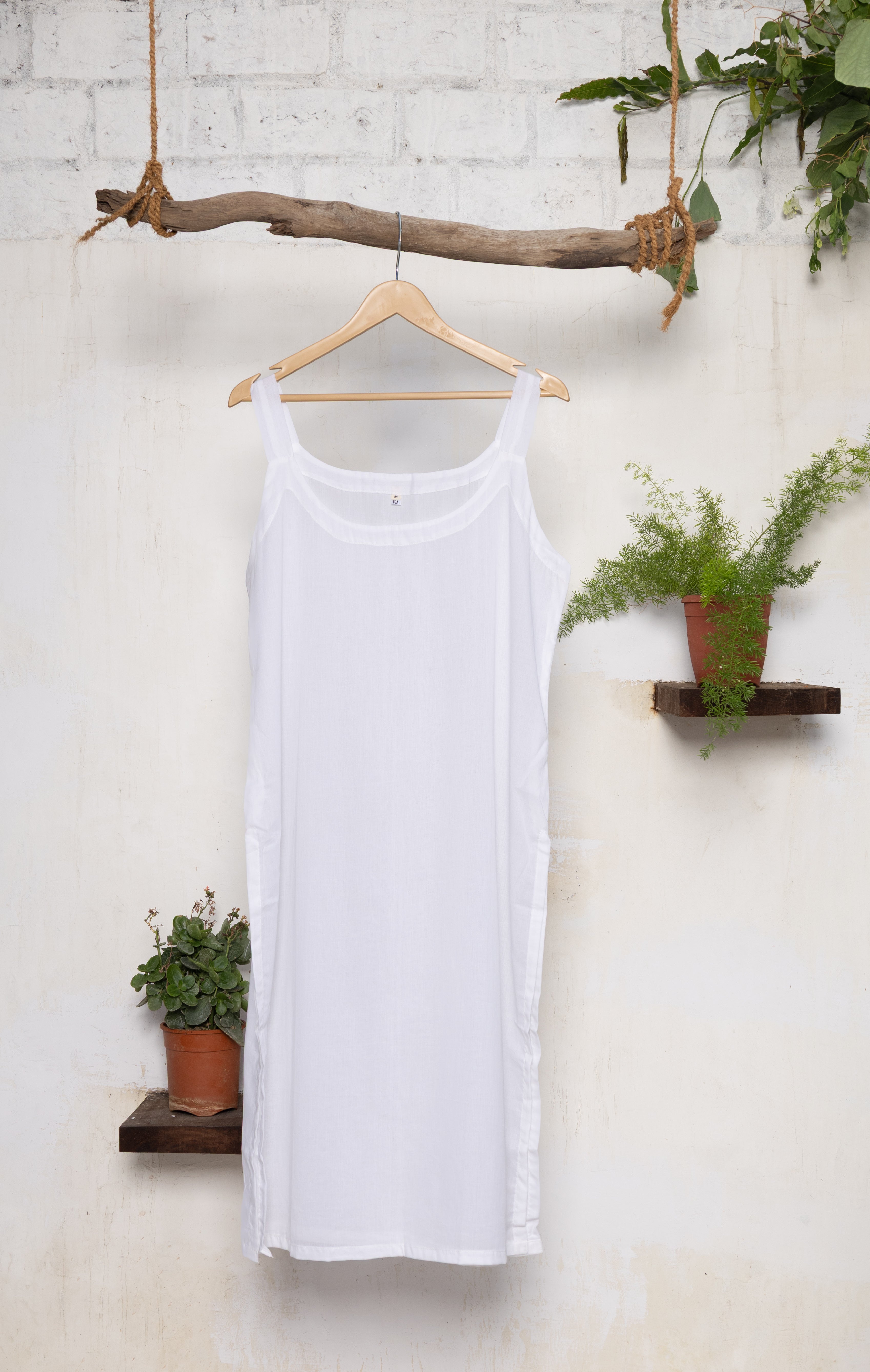 Pack of two natural cotton slips providing smooth, comfortable layering under chiffon, mul, or georgette fabrics.