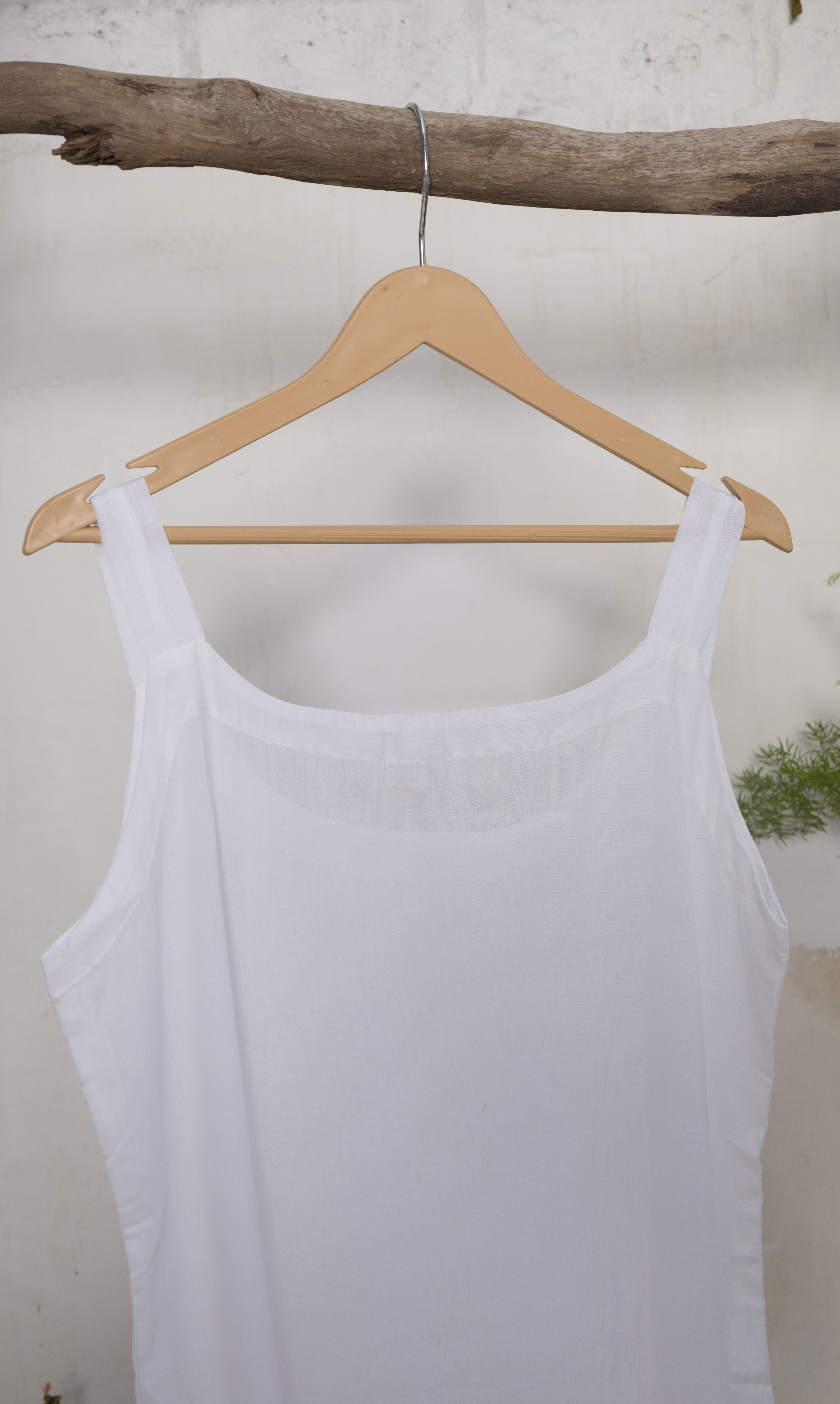 Round neck cotton slips in neutral shades, perfect for layering under sheer or delicate fabrics like silk and chiffon.