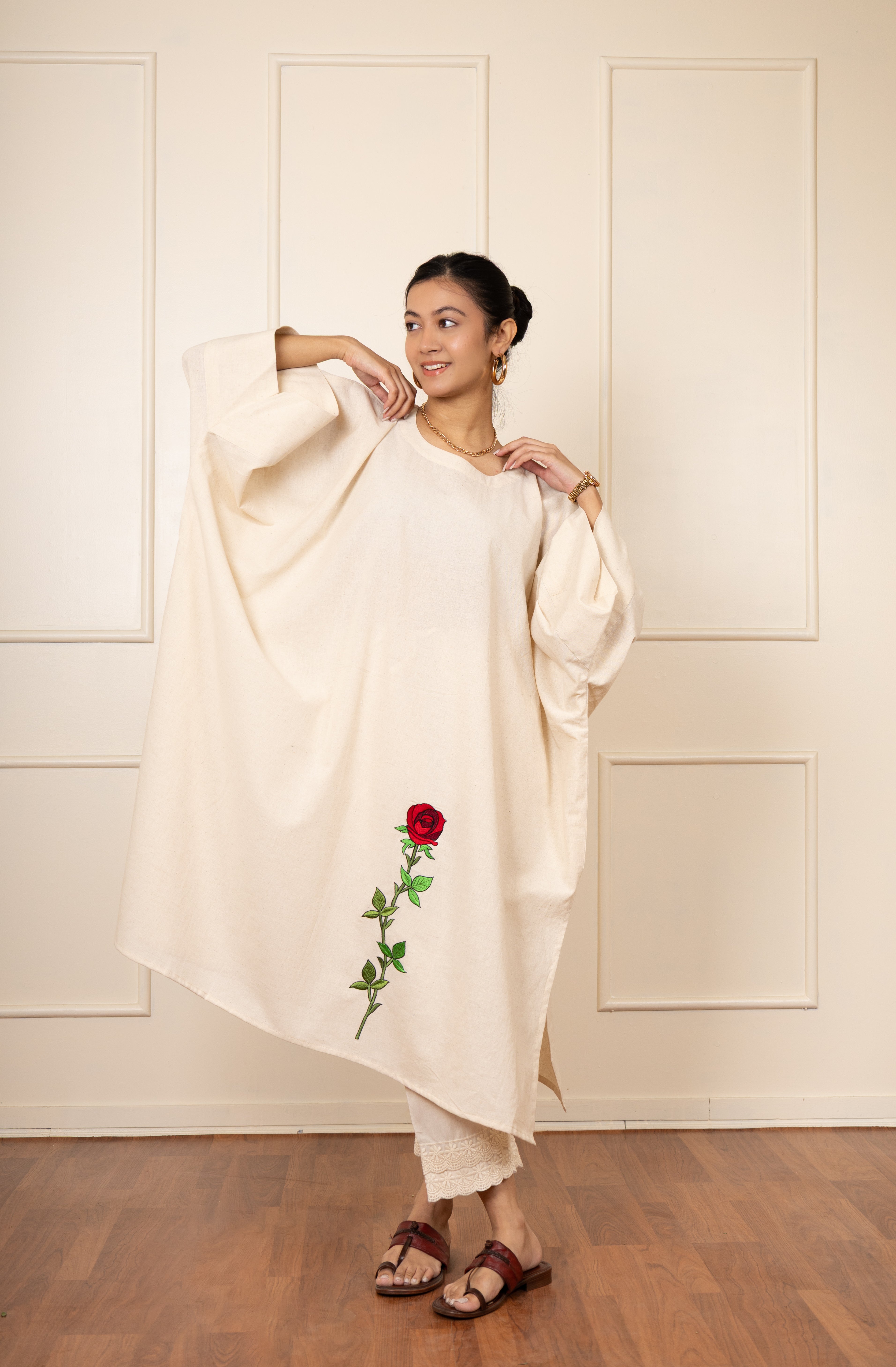 Loose fit beige embroidered kurta dress with floral motif and breathable cotton-linen fabric