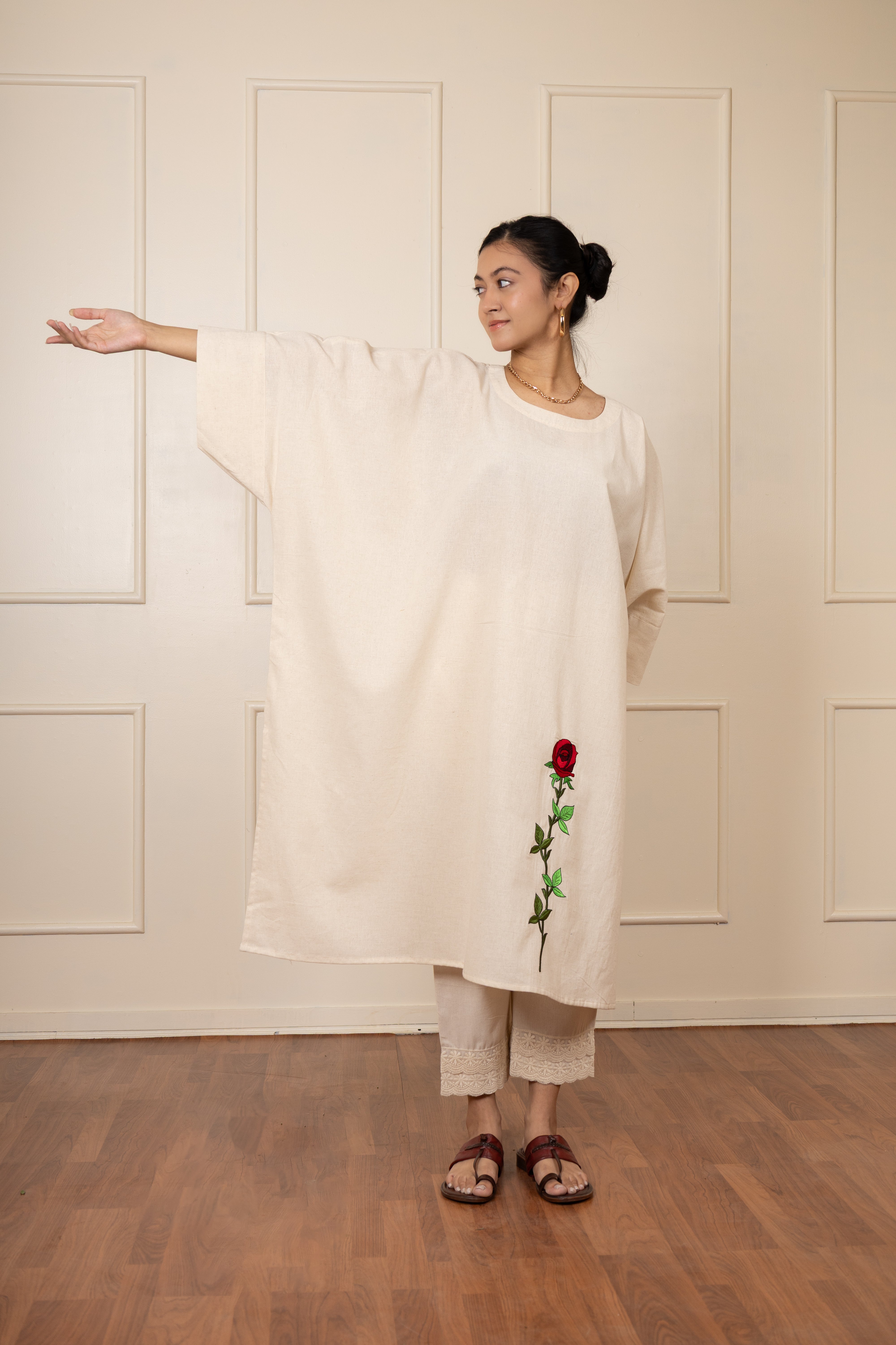 Beige hand-embroidered kaftan kurta with floral detailing, breezy and stylish outfit