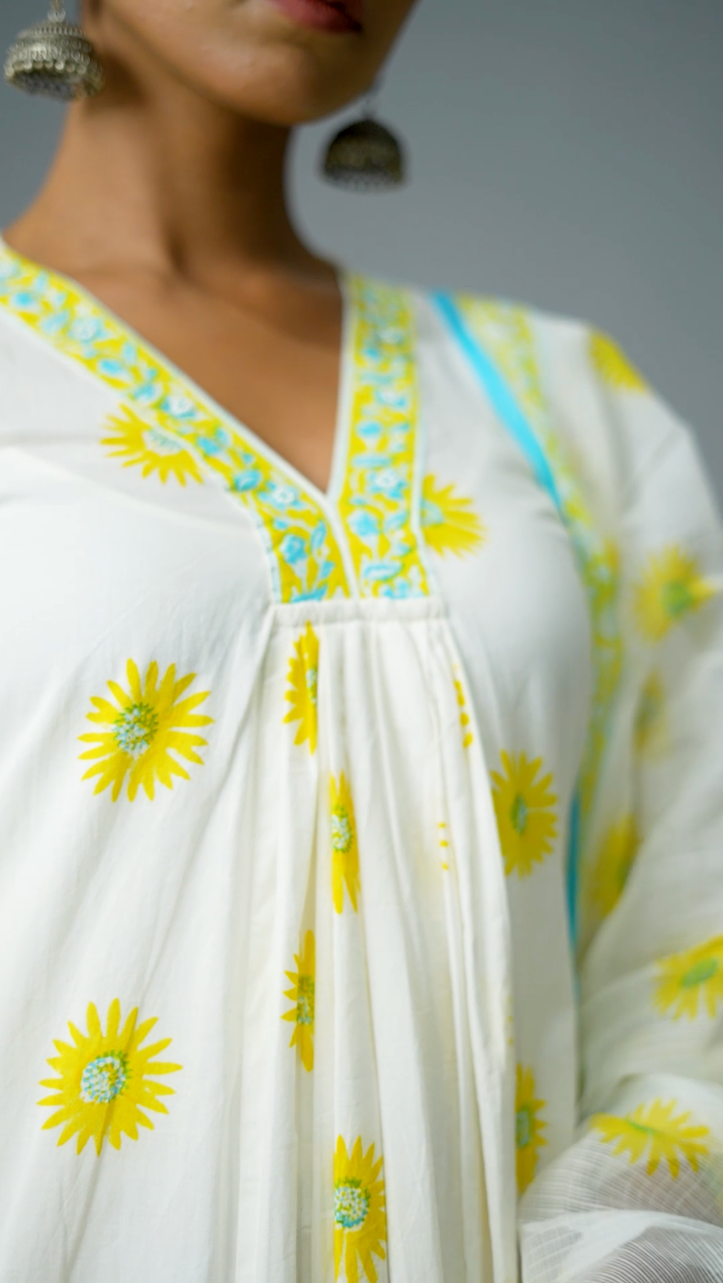 Yellow sunflower motif kurta with Kota Doria dupatta and cotton pants
